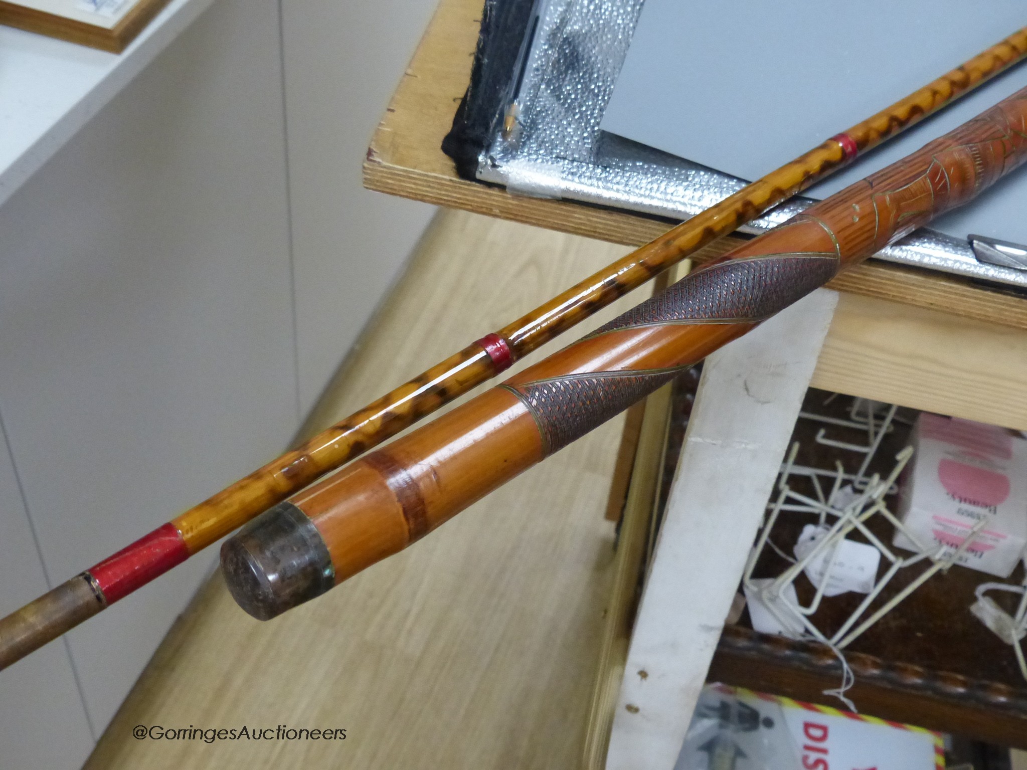 A Japanese carved bamboo walking stick and a Persian polychrome painted walking cane, tallest 97cm